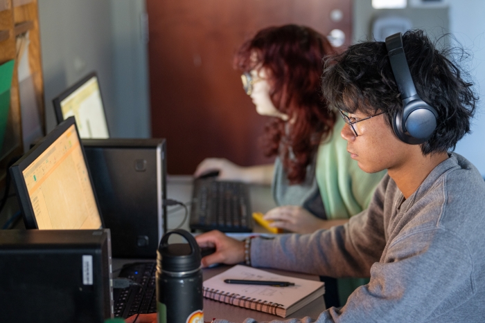 Students work on computers.