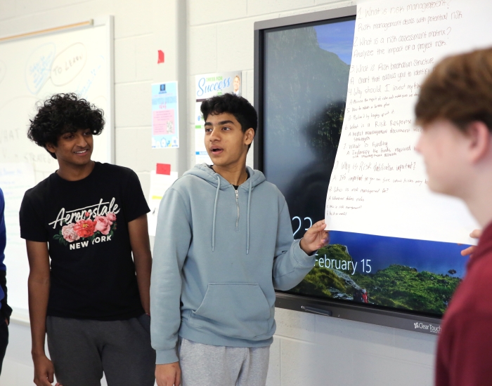 Students present information to a class. 