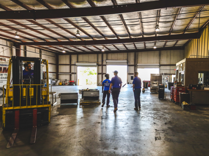 Students walking through a warehouse